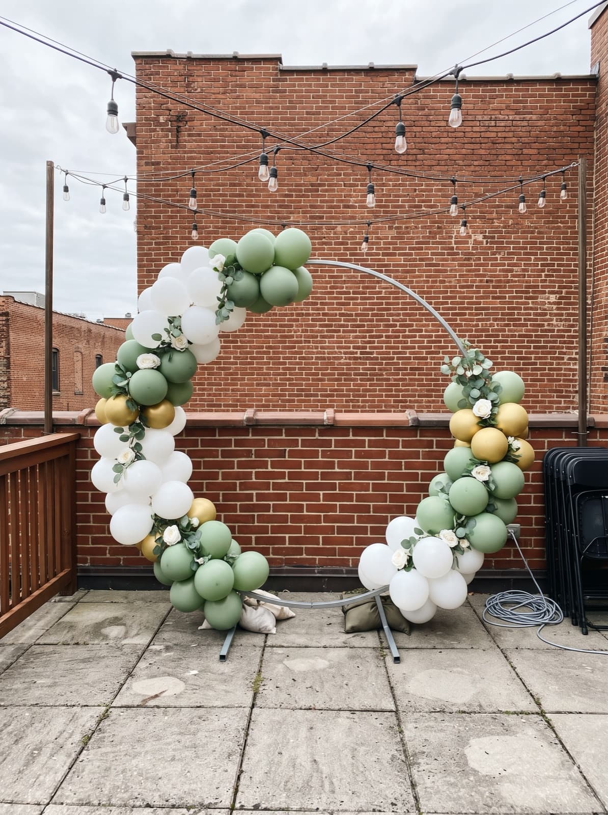 Balloon hoop with florals on a rooftop terrace
