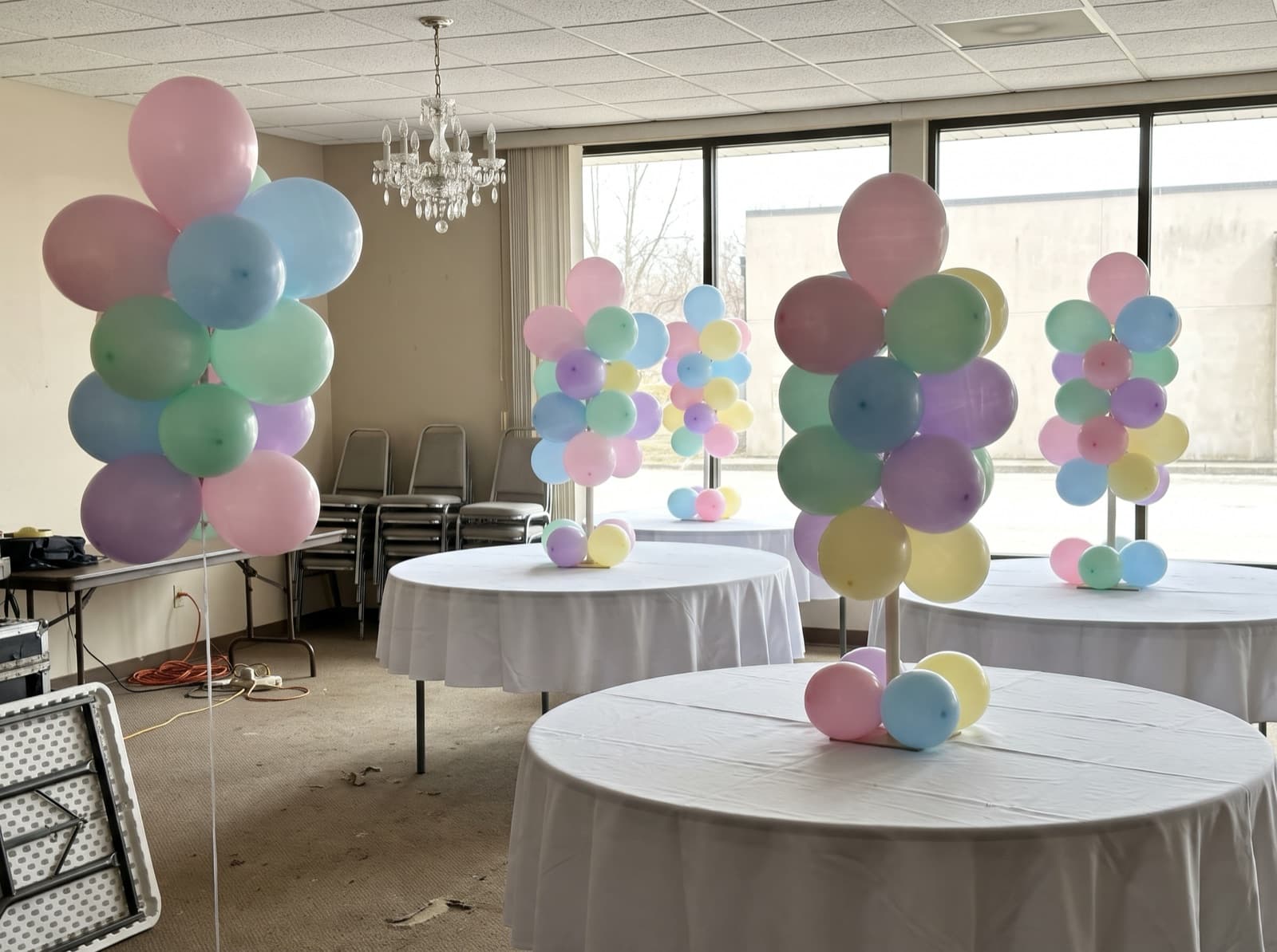 Mini pastel balloon columns as banquet centerpieces