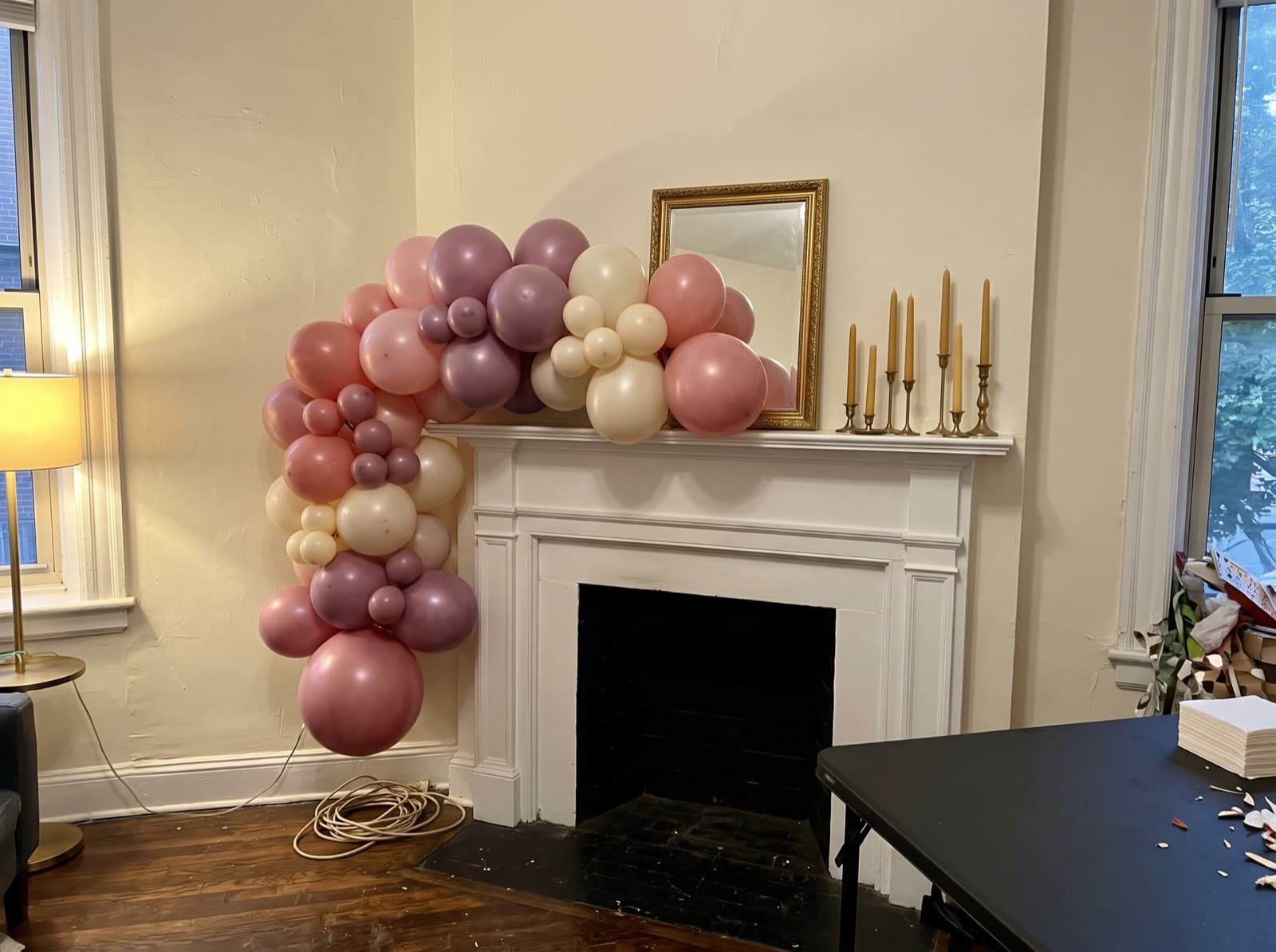 Organic balloon garland in dusty pink and mauve on a prewar mantel