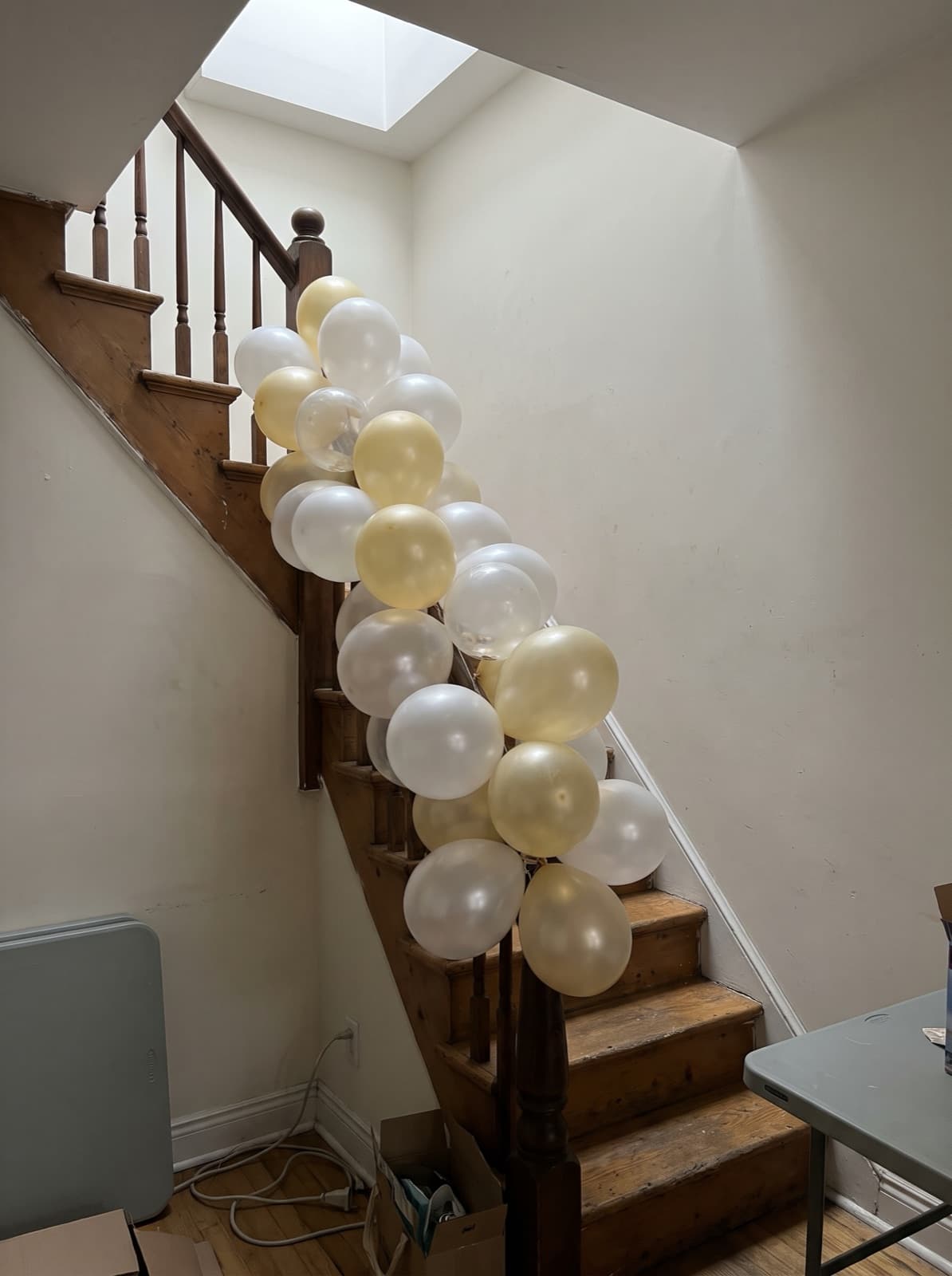 Balloon garland down a narrow townhouse staircase