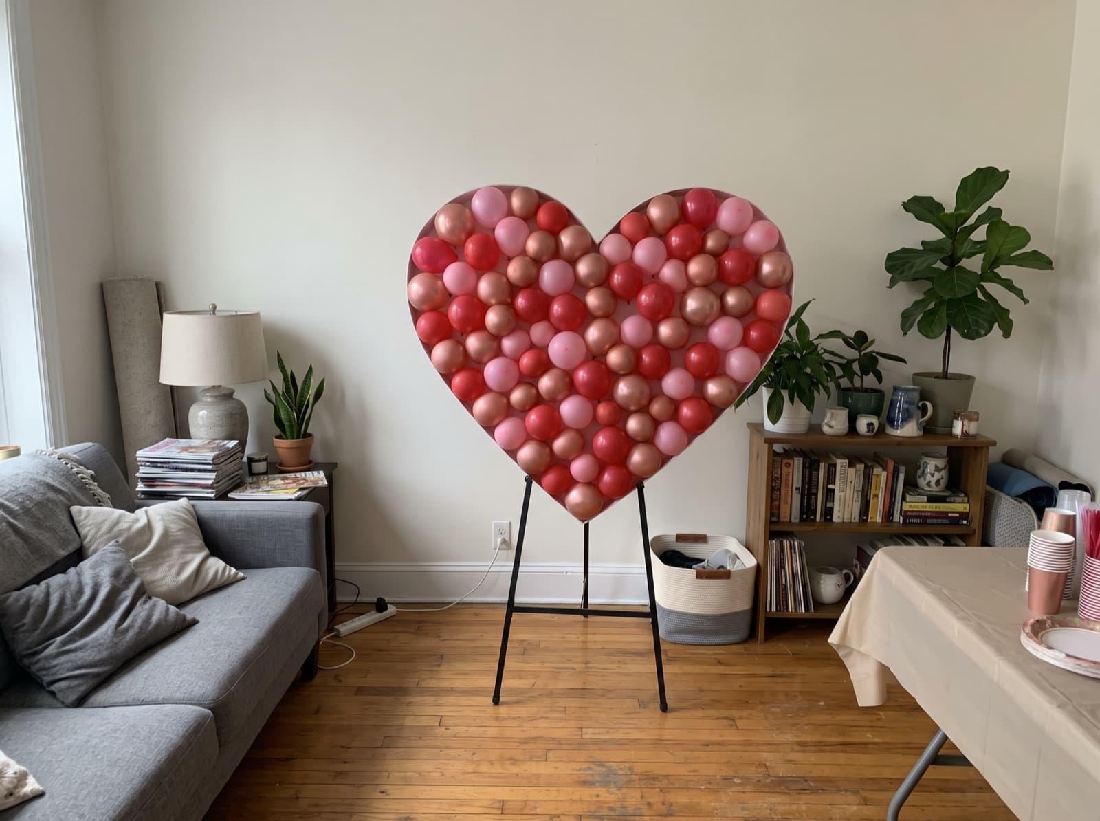 Heart-shaped balloon mosaic in red and pink